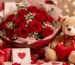 Cute teddy bear holding a heart-shaped cushion beside a luxurious bouquet of fresh red roses, gift box, greeting card, and romantic decorations, perfect for online gift delivery in Pakistan.